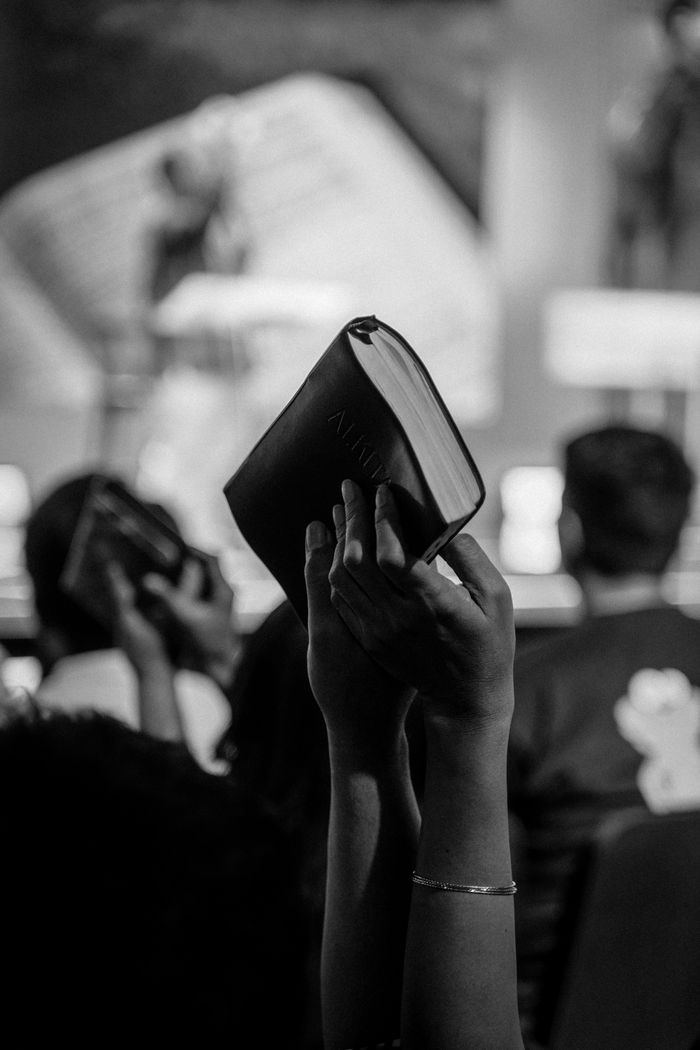 summer-sale Monochrome image of a religious congregation in Jakarta, Indonesia, with raised Bibles.