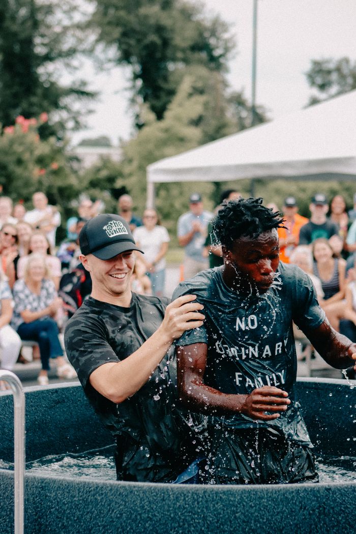 about-us-02 Outdoor baptism ceremony capturing joy and community spirit in Clemson, South Carolina.
