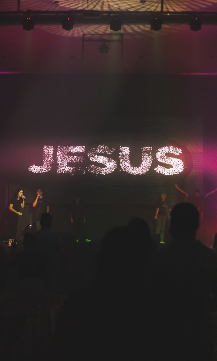 collection-01 A dynamic worship music concert with a focus on Jesus, featuring live performers and vibrant lighting.